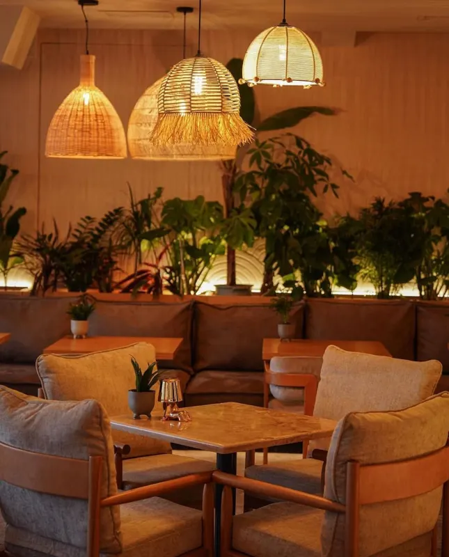 Lounge sofas under rattan lamps